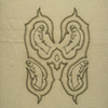 One from The Hero Suite (a suite of 8 pieces); 2001; embroidery in canvas, black leather, silver leaf on cast plastic; this piece 20 ½ x 17 ½ x 2 ¾ inches