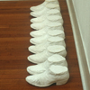 Half Boots; 2000; plaster; 5 x 50 x 12 inches